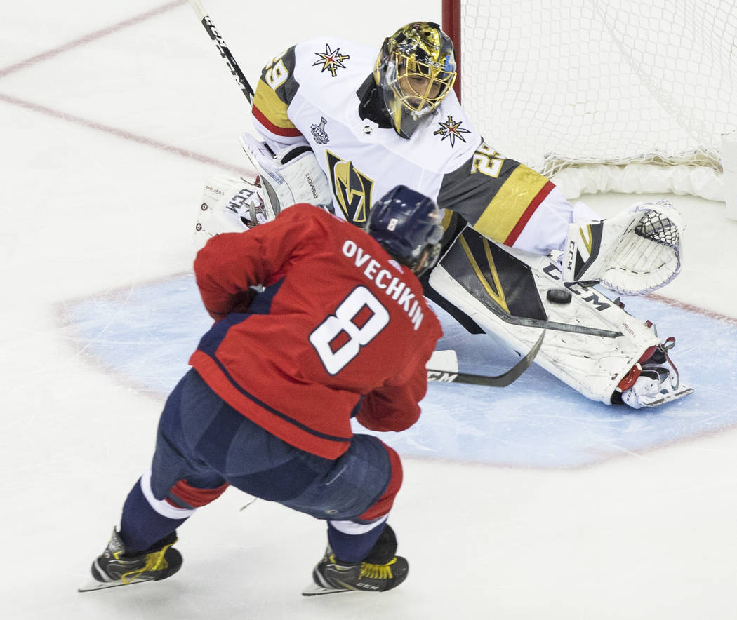 Golden Knights goaltender Marc-Andre Fleury (29) makes a save against Capitals left wing Alex Ovechkin (8) in the first period during Game 3 of the NHL Stanley Cup Final on Saturday, June 2, 2018, ...