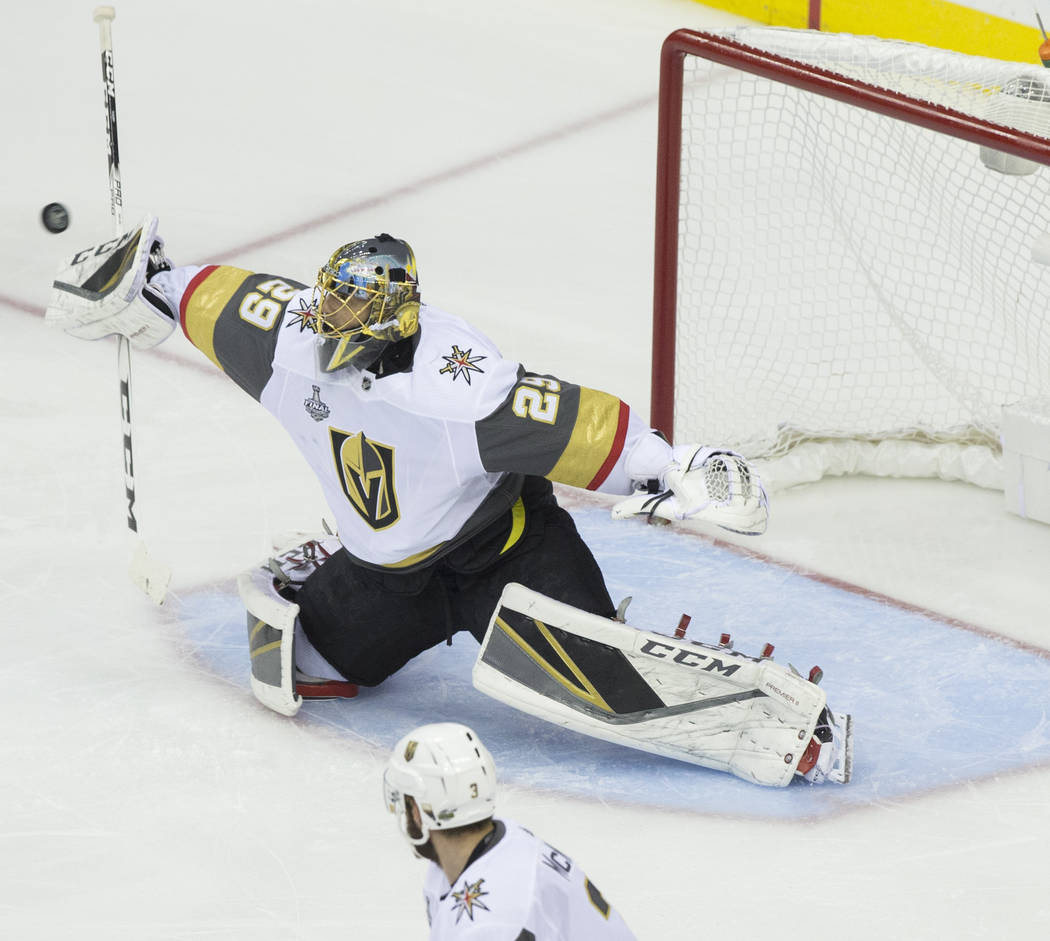 Golden Knights goaltender Marc-Andre Fleury (29) makes a save in the first period during Game 3 of the NHL Stanley Cup Final against the Washington Capitals on Saturday, June 2, 2018, at Capital O ...