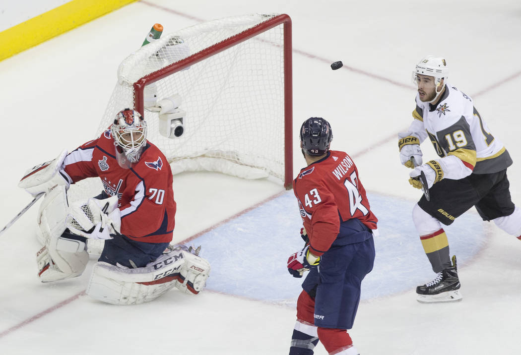 Capitals goaltender Braden Holtby (70) makes a first-period save against Golden Knights right wing Reilly Smith (19) during Game 3 of the NHL Stanley Cup Final on Saturday, June 2, 2018, at Capita ...