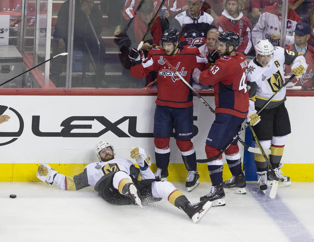 Golden Knights left wing James Neal (18) is knocked down by Capitals defenseman Christian Djoos (29) in the second period during Game 3 of the NHL Stanley Cup Final on Saturday, June 2, 2018, at C ...