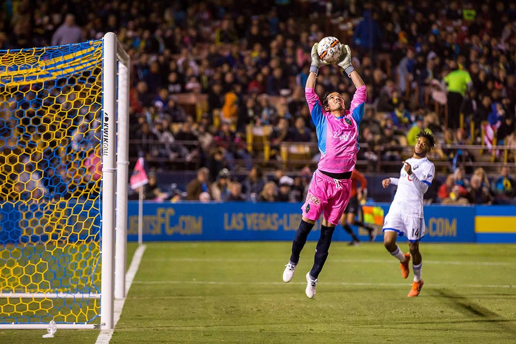 Las Vegas Lights' goalkeeper Ricardo Ferrino grabs the ball while playing against Montreal Impact during the first Las Vegas Lights FC game at Cashman Field in Las Vegas on Saturday, Feb. 10, 2018 ...