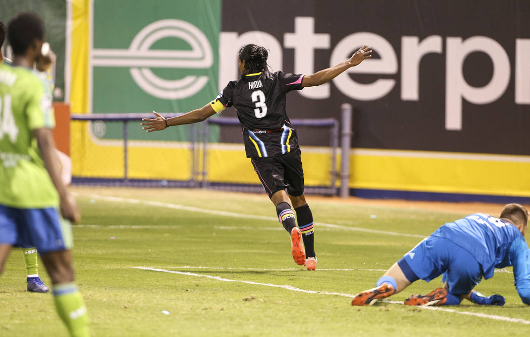 Las Vegas Lights FC defender Joel Huiqui (3) celebrates after scoring on Seattle Sounders FC 2 goalie Calle Brown, right, during the first half of a United Soccer League match at Cashman Field in ...