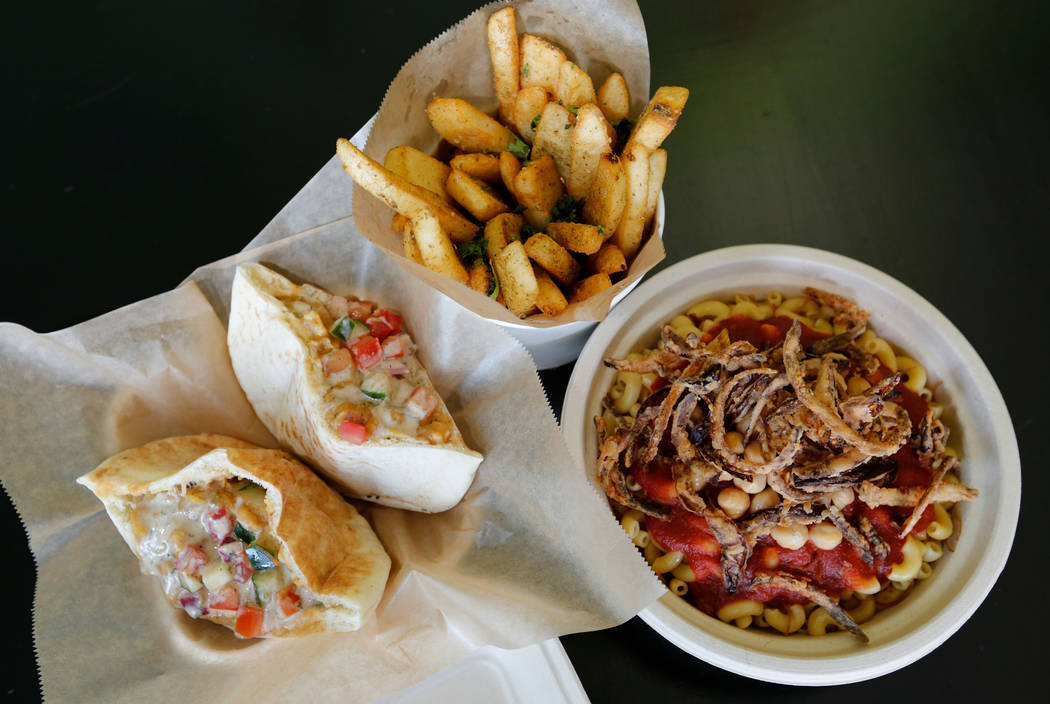 Ful Mudammas, from left, Egyptian Fries and Koshari are served at Pots in Las Vegas, Thursday, June 7, 2018. Pots is a vegan and vegetarian restaurant, which serves Egyptian cuisine. (Chitose Suzu ...