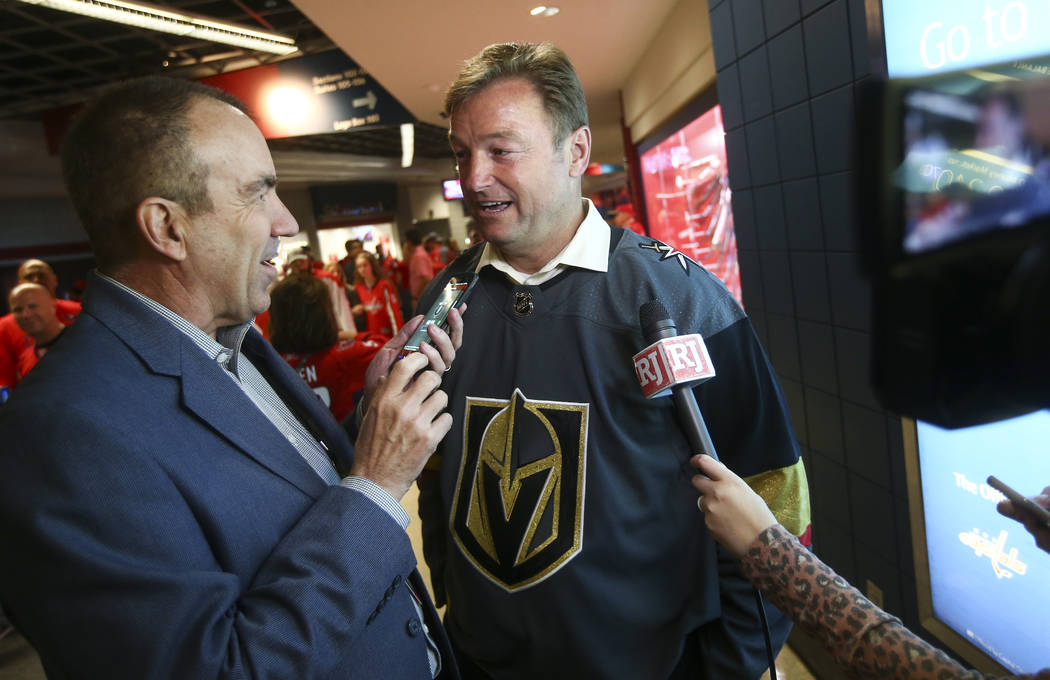 Review-Journal columnist Ron Kantowski talks with U.S. Sen. Dean Heller, R-Nev., before the start of Game 4 of the Stanley Cup Final at Capital One Arena in Washington on Monday, June 4, 2018. Cha ...