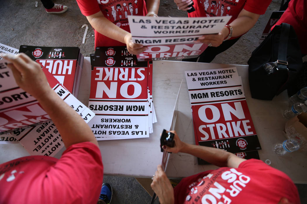 Culinary Union organizers make strike picket signs at the newly opened “Strike HQ” at the intersection of Wyoming Avenue and Fairfield Avenue in Las Vegas, Friday, June 1, 2018. Erik ...