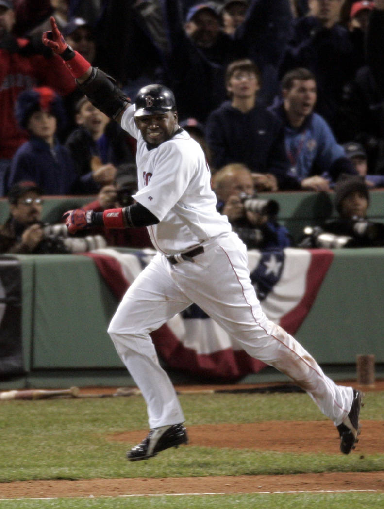 FILE- In this Oct. 18, 2004, file photo, Boston Red Sox's David Ortiz  celebrates his 14th inning game-winning single that scored teammate Johnny  Damon to beat the New York Yankees 5-4 in