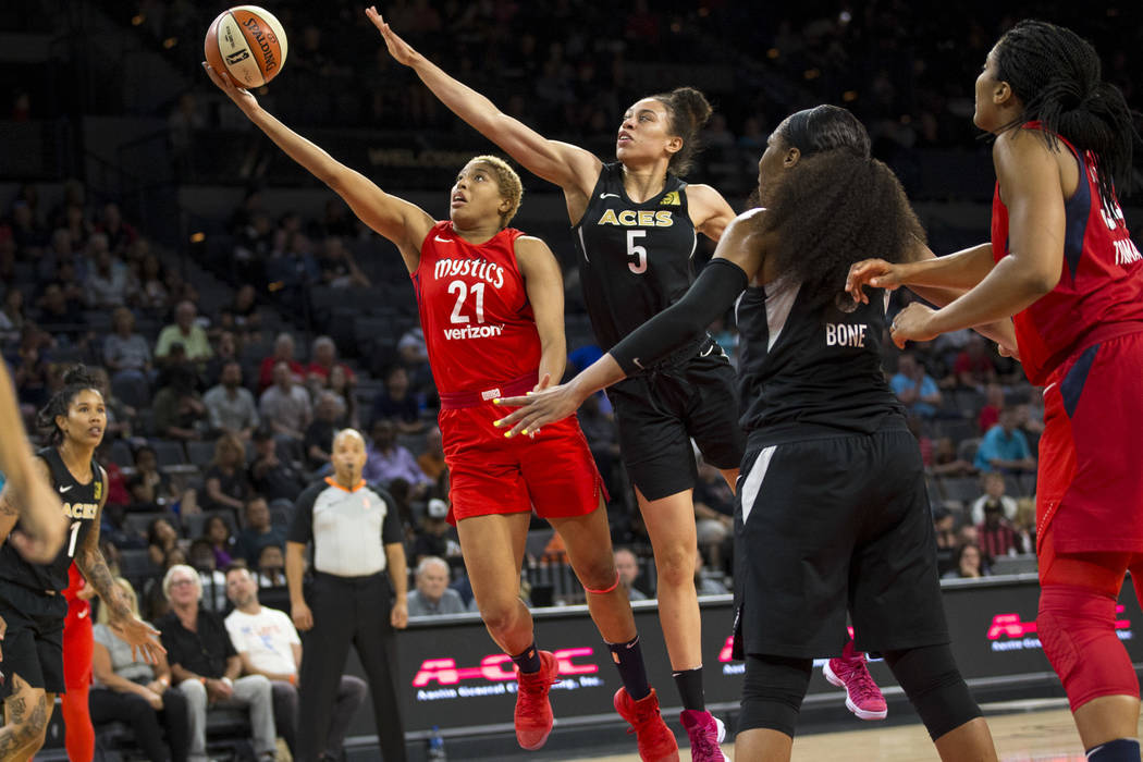 Washington Mystics forward Tianna Hawkins (21) takes a shot against Las Vegas Aces forward Dearica Hamby (5) in the first half of a WNBA basketball game at the Mandalay Bay Events Center in Las Ve ...