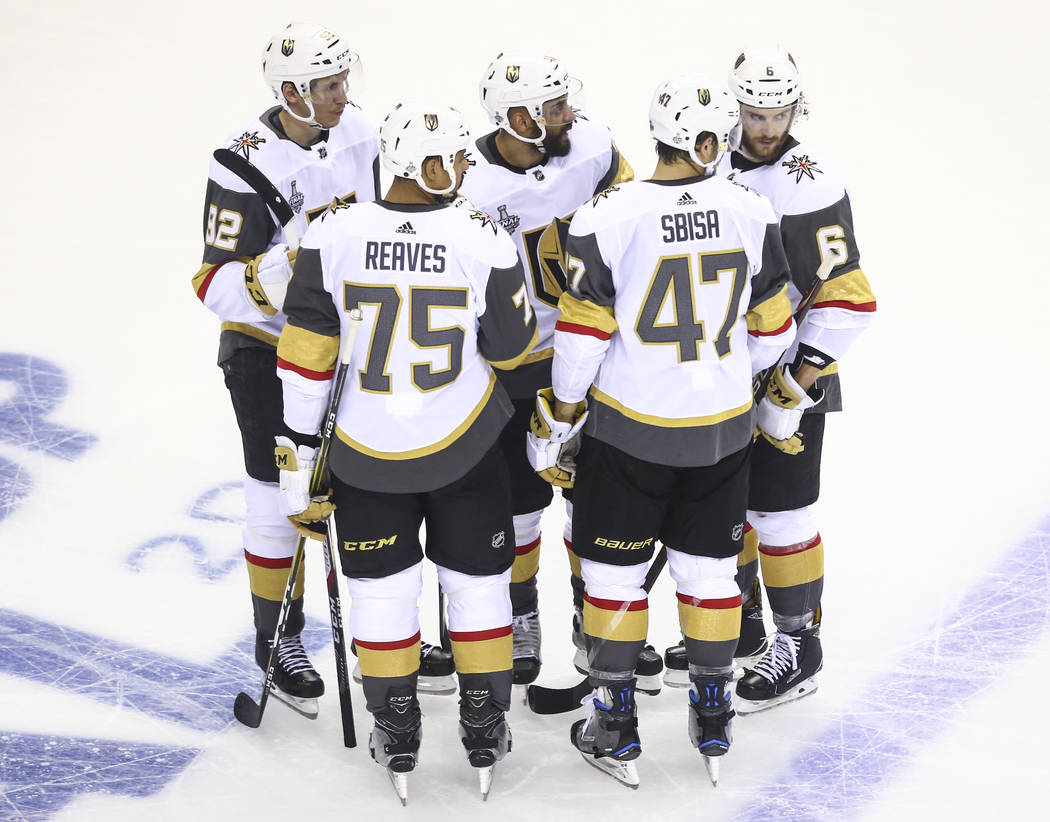 Golden Knights talk during a break in play during the second period of Game 4 of the Stanley Cup Final against the Washington Capitals at Capital One Arena in Washington on Monday, June 4, 2018. C ...