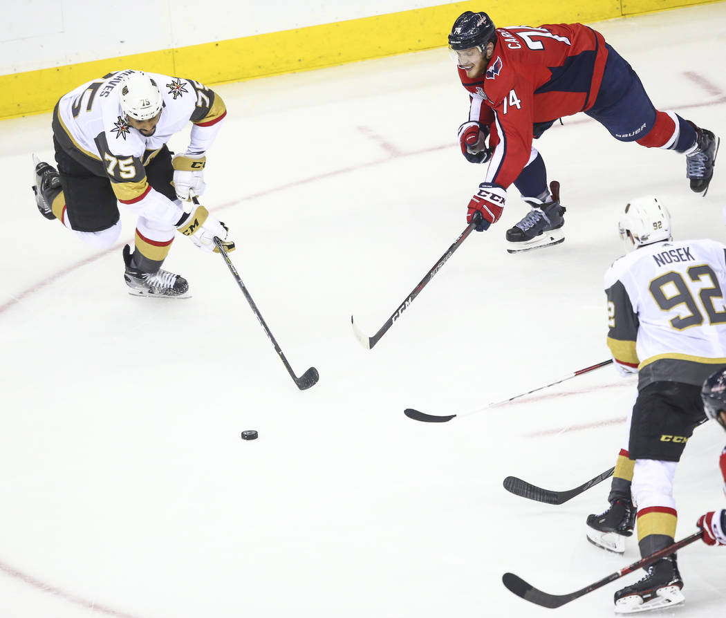 Golden Knights right wing Ryan Reaves (75) goes for the puck against Washington Capitals defenseman John Carlson (74) during the third period of Game 4 of the Stanley Cup Final at Capital One Aren ...