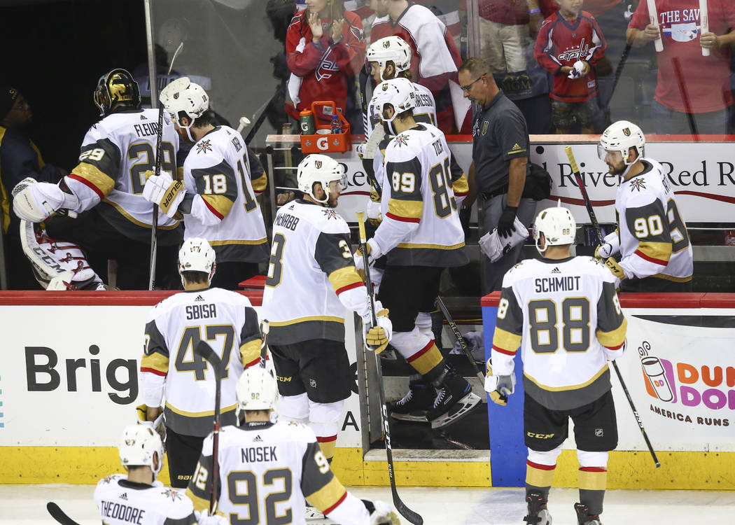 Golden Knights players head to the locker room after losing 6-2 to the Washington Capitals during the third period of Game 4 of the Stanley Cup Final at Capital One Arena in Washington on Monday, ...