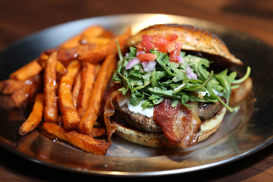 The Fresno Fig Burger, served with fig marmalade, melted goat cheese, bacon, tomato, red onion, arugula, and spicy porter mustard, at Eureka restaurant, 520 E. Fremont St., in Las Vegas, Wednesday ...