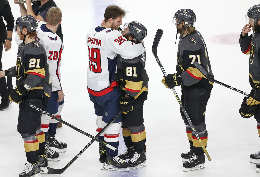 Washington Capitals right wing Alex Chiasson (39) and Vegas Golden Knights center Jonathan Marchessault (81) share a hug after the Capitals defeated the Knights 4-3 to win the NHL hockey Stanley C ...