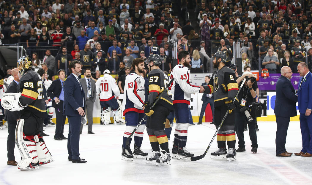 Washington Capitals players shake hands with Golden Knights players after the Capitals won Game 5 to win the Stanley Cup Final at T-Mobile Arena in Las Vegas on Thursday, June 7, 2018. Chase Steve ...