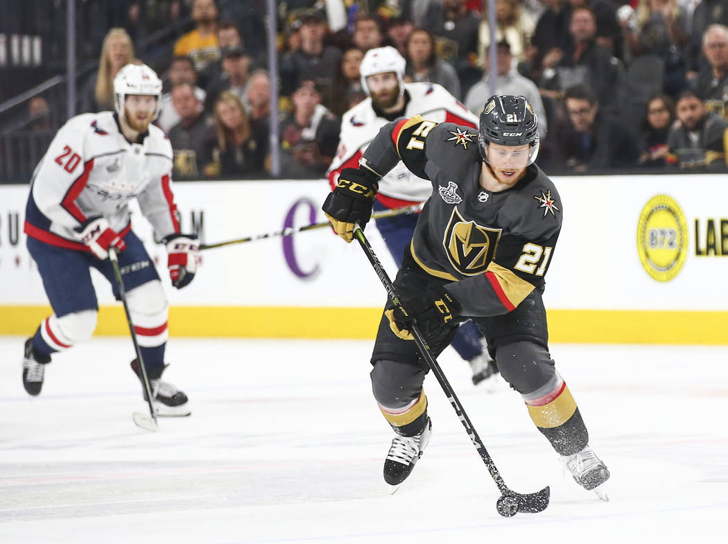 Alex Ovechkin checks Nate Schmidt into the Vegas Golden Knights bench