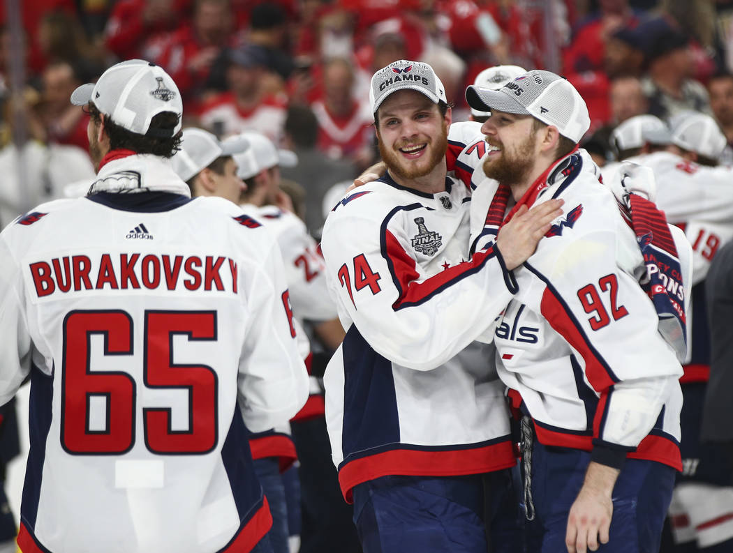 Washington Capitals defenseman John Carlson (74) and Washington Capitals center Evgeny Kuznetsov (92) celebrate after defeating the Golden Knights in Game 5 to win the Stanley Cup Final at T-Mobil ...