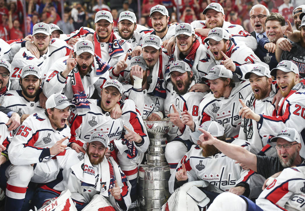 Washington Capitals players celebrate after defeating the Golden Knights in Game 5 to win the Stanley Cup Final at T-Mobile Arena in Las Vegas on Thursday, June 7, 2018. Chase Stevens Las Vegas Re ...