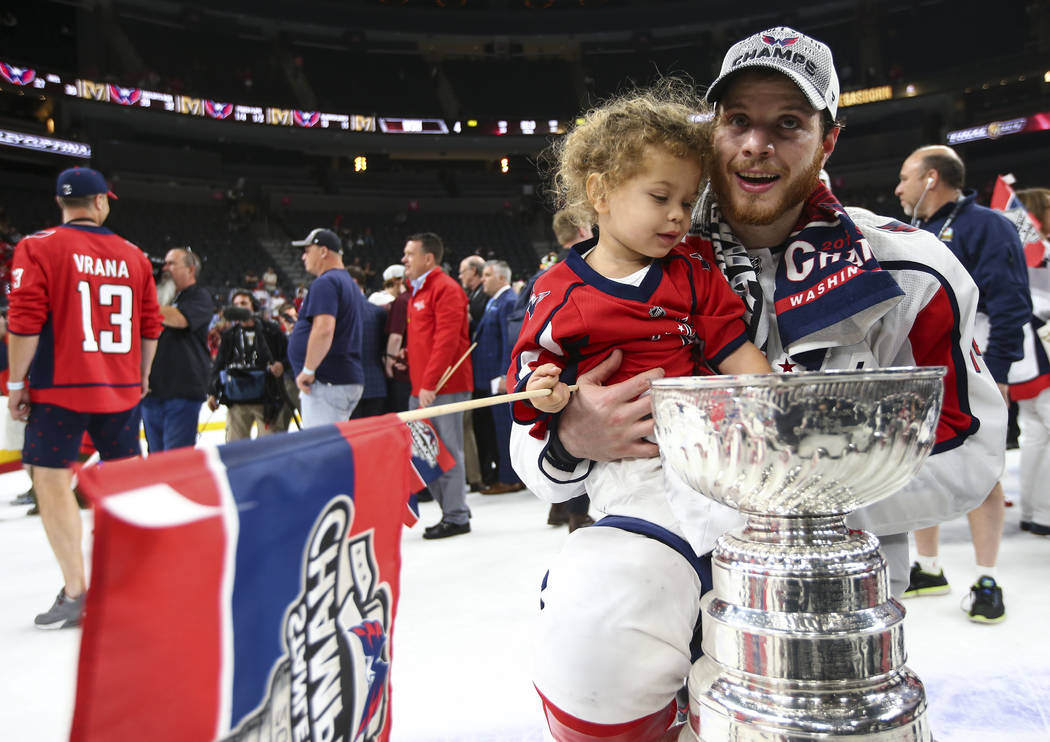 Washington Capitals defenseman John Carlson (74) with celebrates with his daughter after defeating the Golden Knights in Game 5 to win the Stanley Cup Final at T-Mobile Arena in Las Vegas on Thurs ...