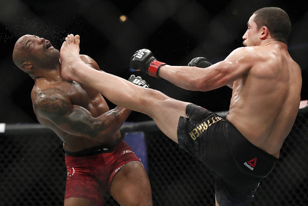 Munching Inn The above Robert Whittaker, right, kicks Yoel Romero in the face during their  middleweight title mixed martial art bout at UFC 225, early Sunday, June  10, 2018, in Chicago. (AP Photo/Jim Young) | Las