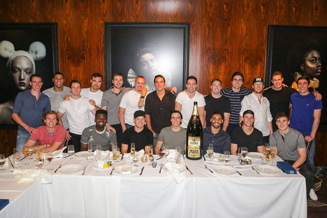 Members of the Vegas Golden Knights, with Palms General Manager Jon Gray (near the center in plumb-colored suit) in are shown during a party celebrating the close of the 2017-18 season at Scotch ...