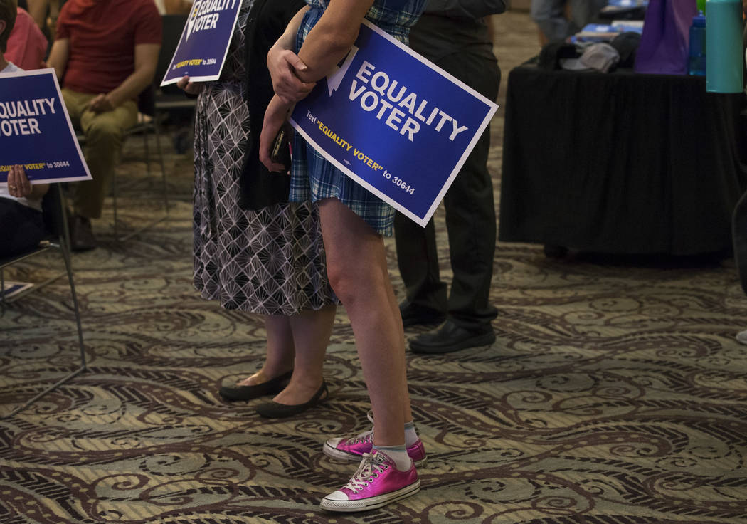 People listen to Assemblyman and Secretary of State candidate Nelson Araujo during a Get Out the Vote rally hosted by the Human Rights Campaign at The Gay and Lesbian Community Center of Southern ...