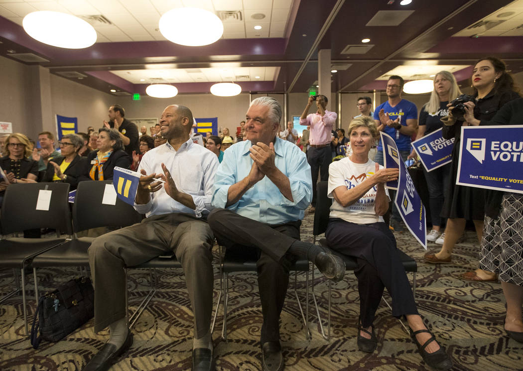 State Senator and Attorney General candidate Aaron Ford, from left, and Democratic gubernatorial candidates Steve Sisolak and Chris Giunchigliani applaud Congresswoman Dina Titus (not shown) durin ...