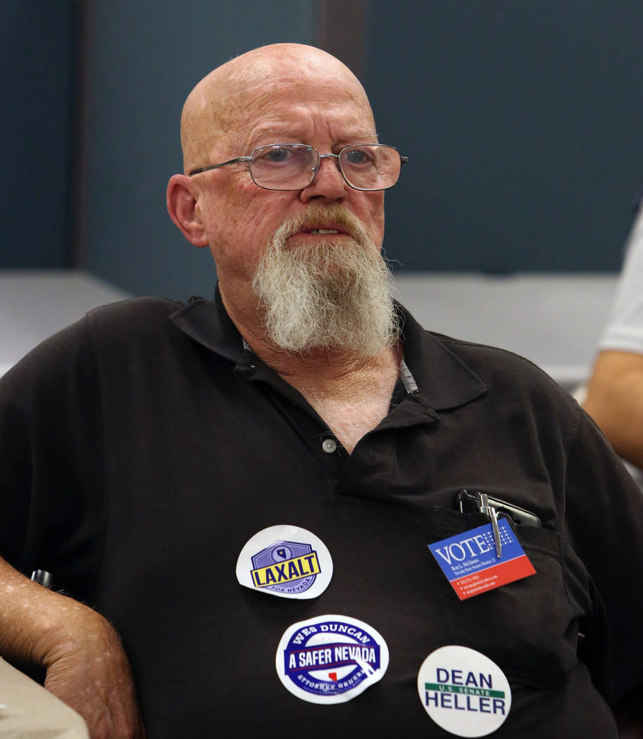 Ron McGinnis of Las Vegas watches update election results at a primary election night watch party, hosted by the Republican National Committee and Nevada Republican Party, on Tuesday, June 14, 201 ...