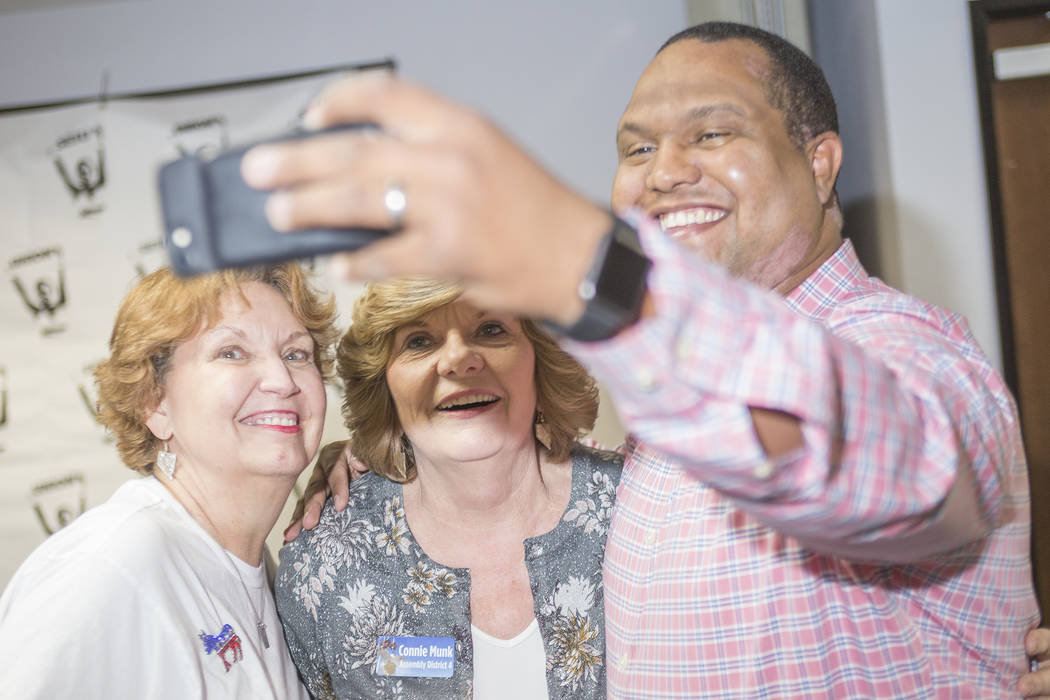 Donna West, the chair for the Clark Country Democratic party, from left, takes a selfie with Connie Munk, a Democrat running for Nevada Assembly District 4, and Alex Goff at a Democrat primary ele ...