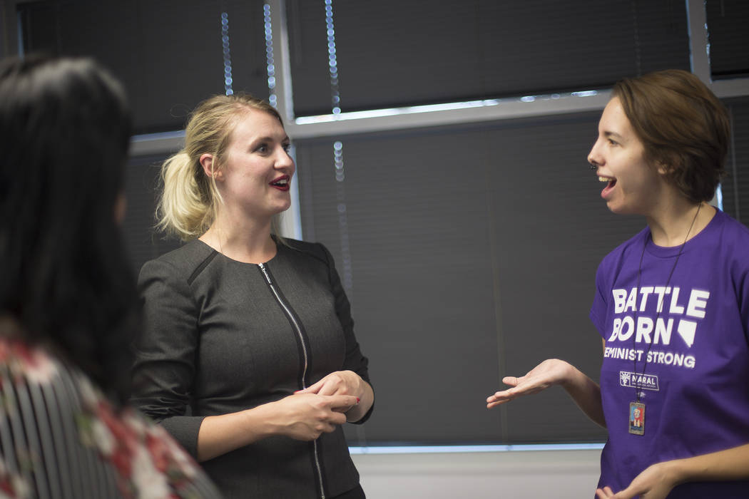 Melanie Scheible, a Democrat running for state Senate District 9, talks to Rachel Siota at a Democrat primary election watch party at the Service Employee International Union's offices in Las Vega ...