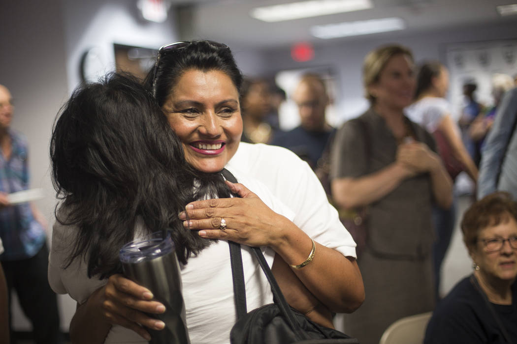 Susan Martinez, Democratic candidate for Assembly District 12, hugs her sister Adriana Martinez as results come in at a Democrat primary election watch party at the Service Employee International ...