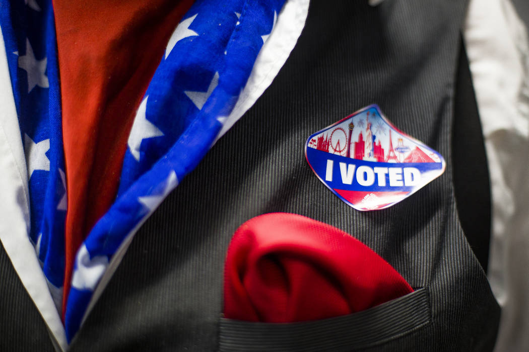 Gil Lopez shows off his American flag patterned clothes at a Democrat watch party at the Service Employee International Union's offices in Las Vegas, Tuesday, June 12, 2018. The primary election i ...