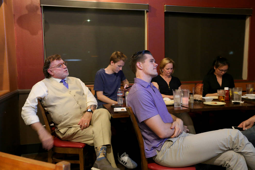 Clark County district attorney candidate, defense attorney Robert Langford, left, watches election results during a watch party at Bacon Bar on North Rancho Drive in Las Vegas Tuesday, June 12, 20 ...