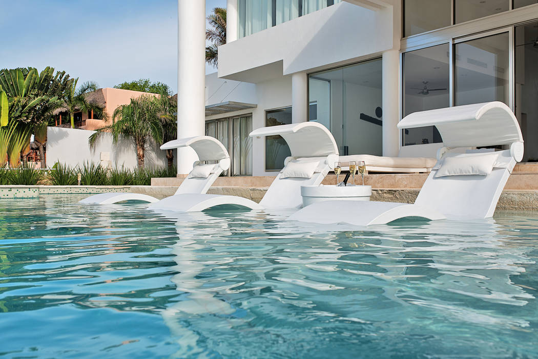 Ledge Lounger These homeowners selected Ledge Lounger in-pool furnishings for their tanning ledge. The items from the Signature series include three chaises with covered shades and pillows and a c ...
