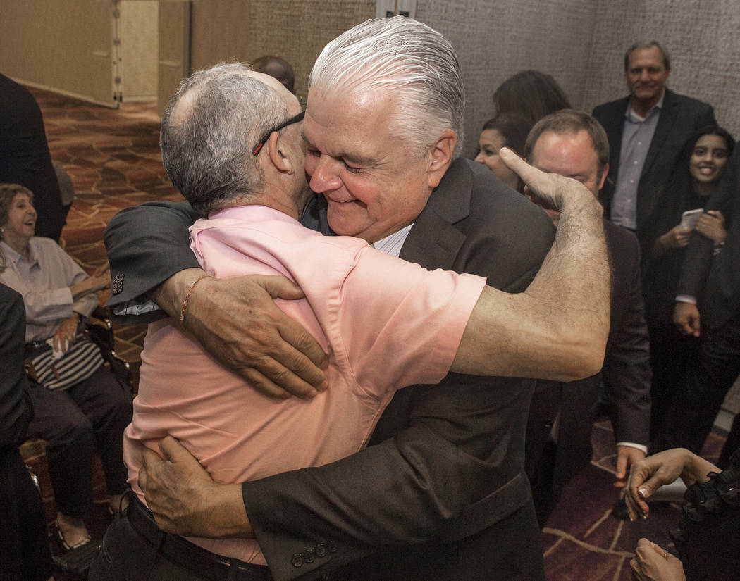 Steve Sisolak, right, hugs a supporter at a watch party after winning the gubernatorial democratic primary at the Aria hotel-casino on Tuesday, June 12, 2018, in Las Vegas. Benjamin Hager Las Vega ...