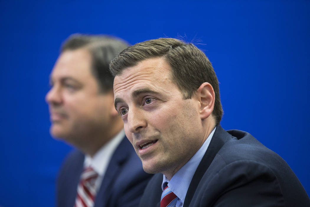 Adam Laxalt, right, Nevada Attorney General and gubernatorial candidate, listens to input from the crowd during a round table discussion on education reform on Wednesday, April 4, 2018, at Laxalt ...