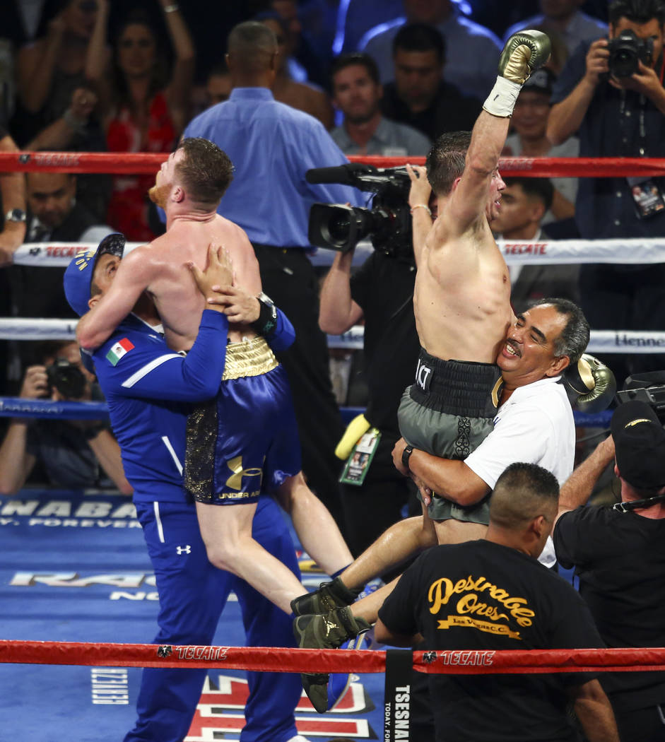 Saul "Canelo" Alvarez, left, and Gennady ҇GGӠGolovkin at the end of their middleweight championship boxing match at T-Mobile Arena in Las Vegas on Saturday, Sept. 16, 2017. T ...