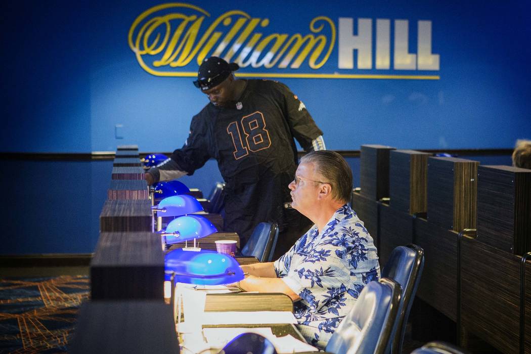 Steve Lewis, from Kansas City, watches a horse race on a TV monitor at the William Hill Race & Sports Book in The Plaza on Friday, March 18,2016. (Jeff Scheid/Las Vegas Review-Journal Follow @jlsc ...