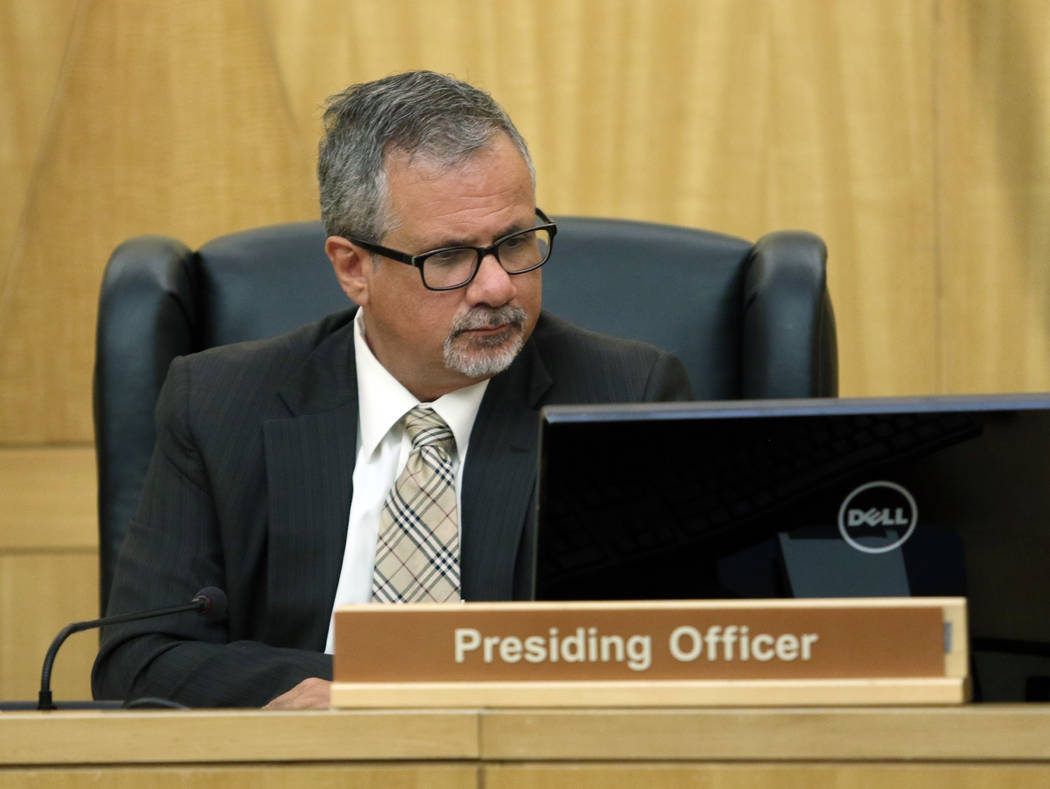 Ozzie Fumo looks over data during a police fact finding review at Clark County Government Center Wednesday, June 10, 2015, in Las Vegas. (Ronda Churchill/Las Vegas Review-Journal)