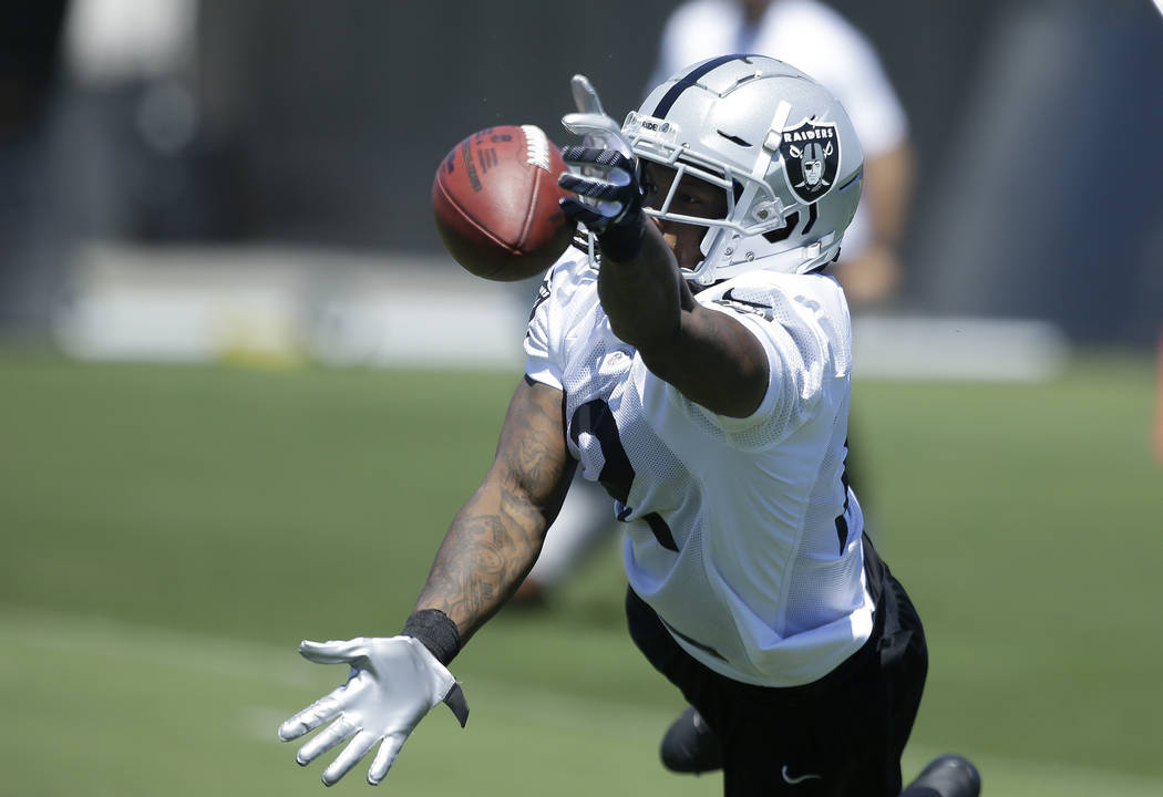 Oakland Raiders wide receiver Martavis Bryant leaps for a pass at the NFL football team's minicamp Wednesday, June 13, 2018, in Alameda, Calif. (AP Photo/Rich Pedroncelli)