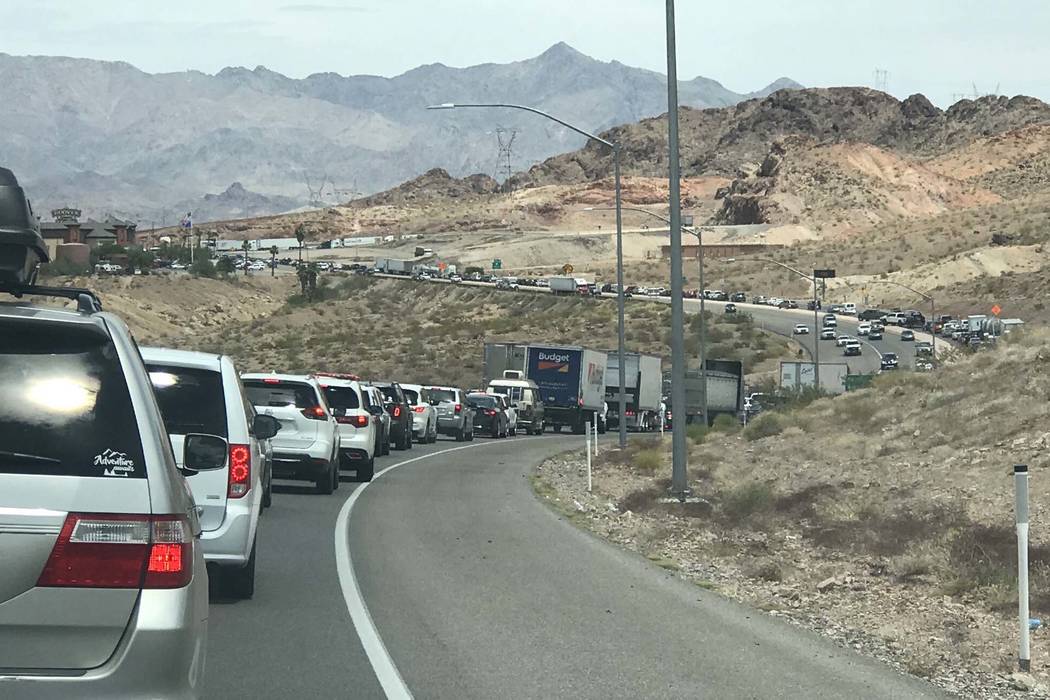Southbound traffic on U.S. Highway 93 south of Las Vegas, headed toward Hoover Dam, was backed up after police closed the Mike O'Callaghan-Pat Tillman Memorial Bridge during an incident with a man ...