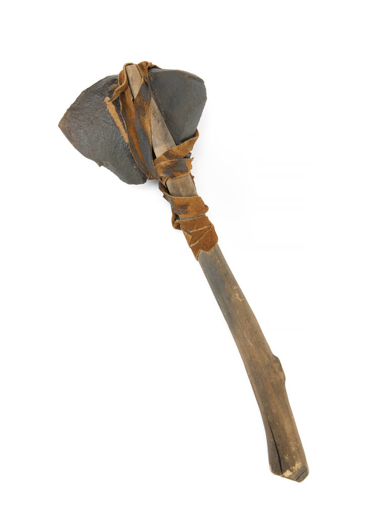 An axe prop weapon used by the Ewoks during "Return of the Jedi" (Lucasfilm, 1983). The prop is custom made, built on a wood handle with leather ties and a synthetic foam-like rock piece on top si ...