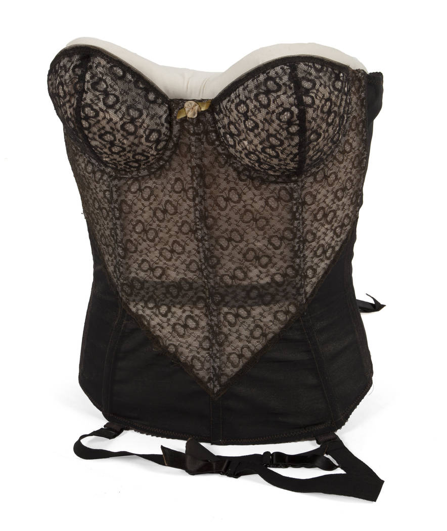 A black lace padded bustier belonged to Marilyn Monroe together with a white female bust. (Julien's Auctions)