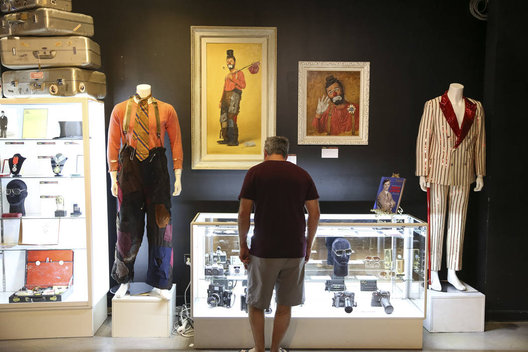A man browses items belonging to late comedian Jerry Lewis on display during the Julian's Auctions Property from the estate of Jerry Lewis inside Planet Hollywood Resort in Las Vegas on Monday, Ju ...
