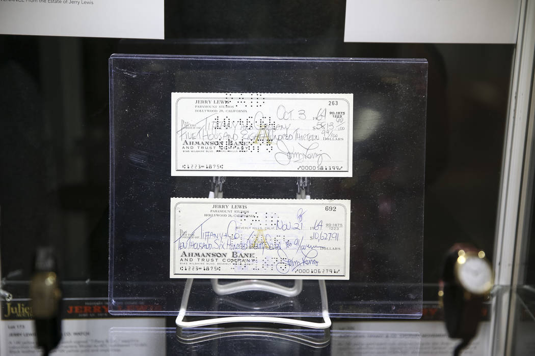 Checks signed by late comedian Jerry Lewis on display during the Julian's Auctions Property from the estate of Jerry Lewis inside Planet Hollywood Resort in Las Vegas on Monday, June 18, 2018. Ric ...