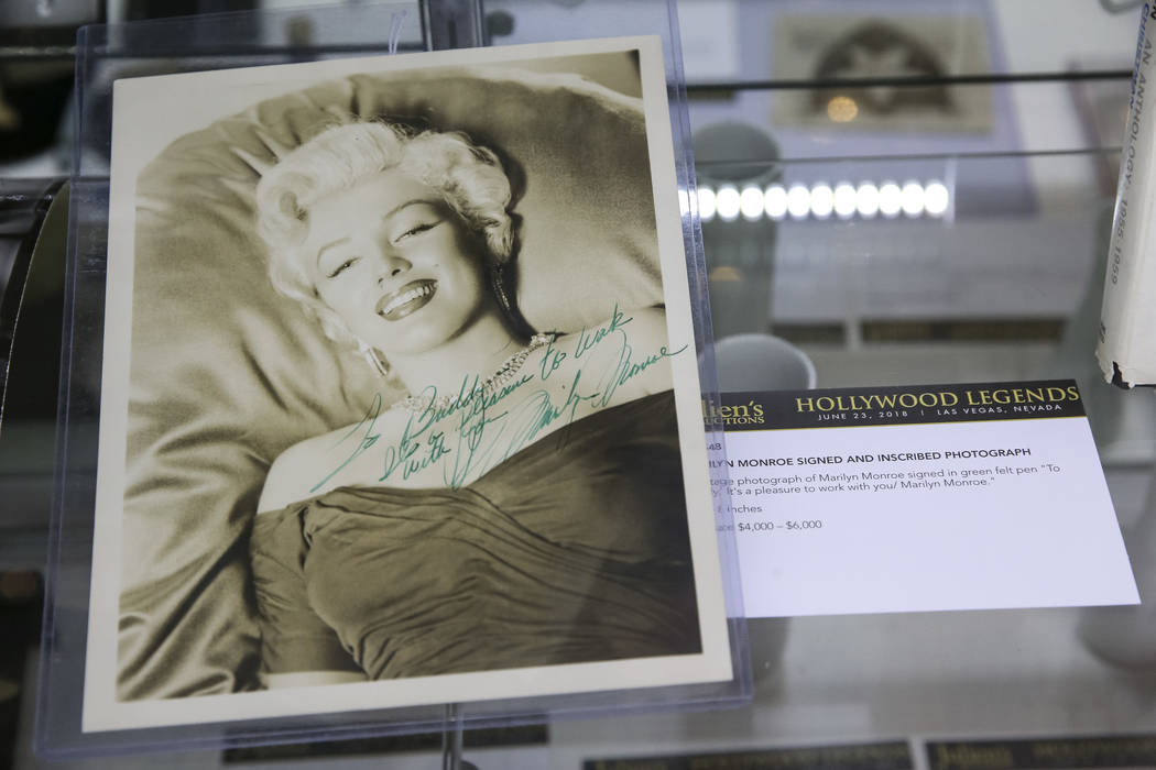 A photo signed by Marilyn Monroe on display as part of Julian's Auctions Hollywood Legends collection at Planet Hollywood in Las Vegas on Monday, June 18, 2018. Items from the Hollywood Legends co ...