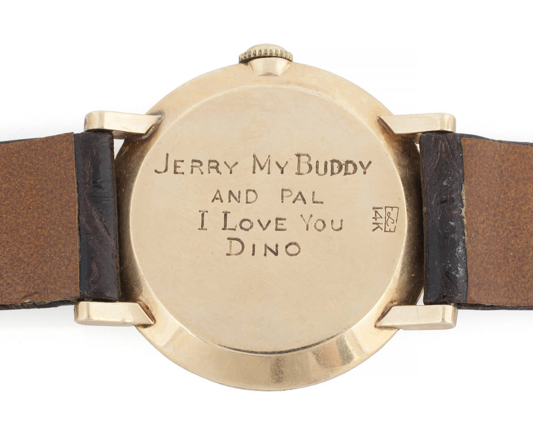 Offered for sale at the Julien's Jerry Lewis & Hollywood Legends Auction on Friday at Planet Hollywood: A 14K yellow gold watch with satin finish and round dials on the gold bezel, signed "Le Coul ...