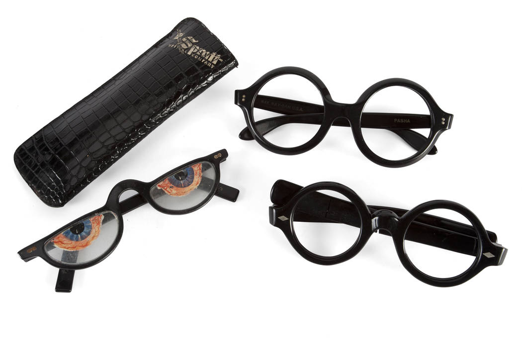 Offered for sale at the Julien's Jerry Lewis & Hollywood Legends Auction on Friday at Planet Hollywood: A trio of vintage prop black glasses frames. The first pair are large round frames with silv ...