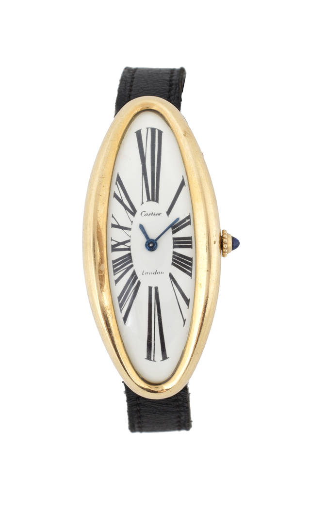 Offered for sale at the Julien's Jerry Lewis & Hollywood Legends Auction on Friday at Planet Hollywood: An 18K yellow gold watch signed Cartier, London, an oval maxi variation from their Baignoire ...