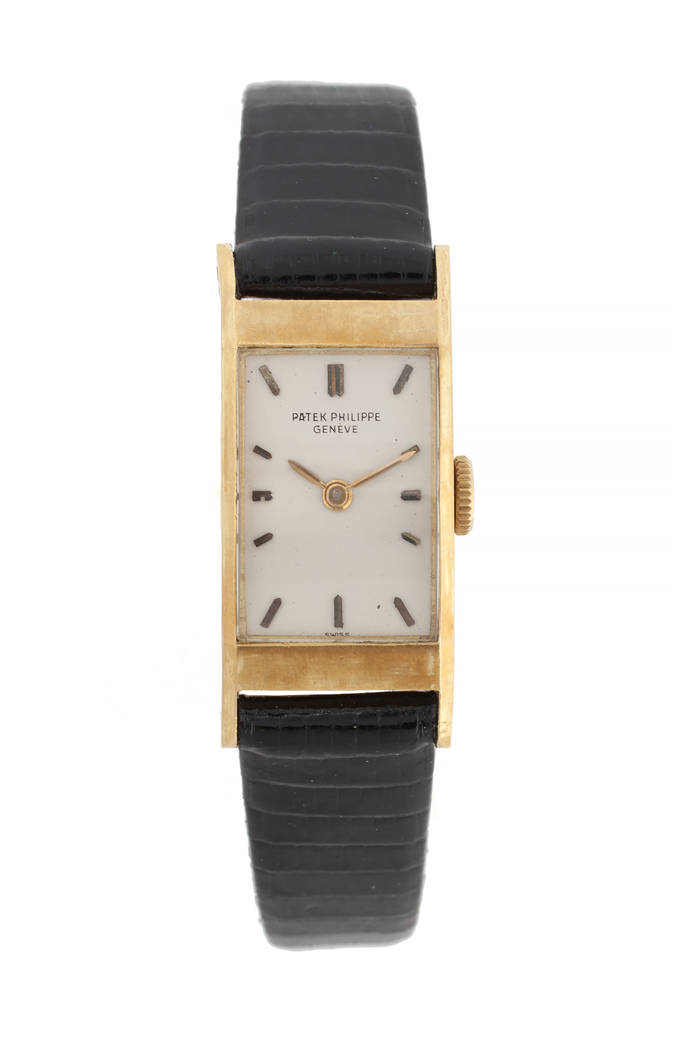 Offered for sale at the Julien's Jerry Lewis & Hollywood Legends Auction on Friday at Planet Hollywood: An 18-karat yellow gold watch with silvered baton chapters from Patek Philippe, Geneve, engr ...