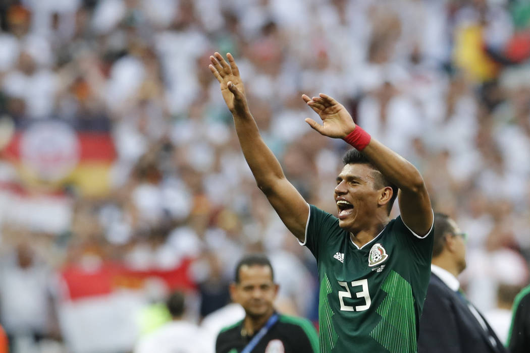 Mexico shocks defending champ Germany 1-0 at World Cup.