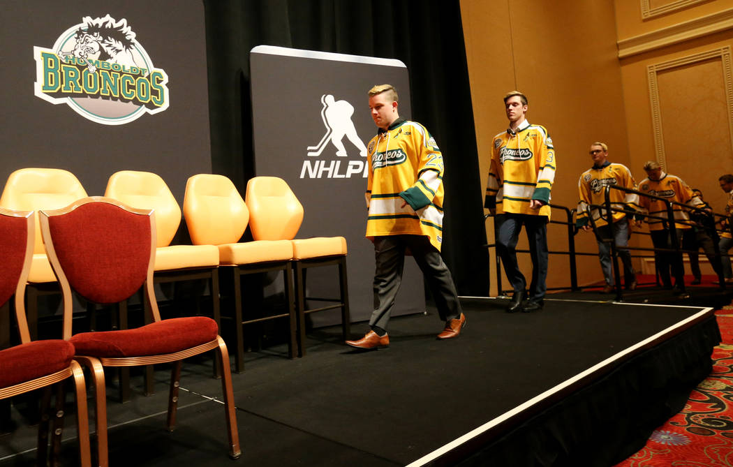 Humboldt Broncos, led by from left Derek Patter, Xavier LaBelle and Graysen Cameron take the stage for a news conference to the news media at the Encore at Wynn Las Vegas Tuesday, June 19, 2018. ...
